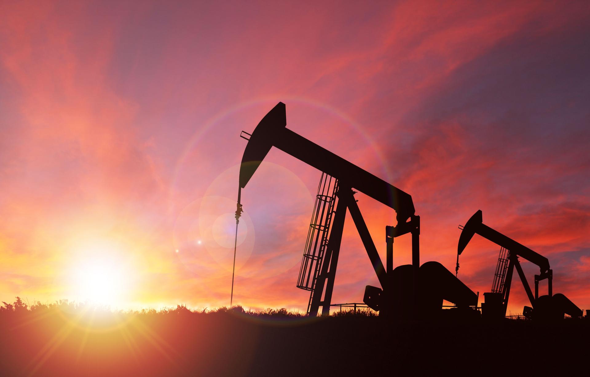 Sunset Over Pumpjack Silhouette With Copy Space